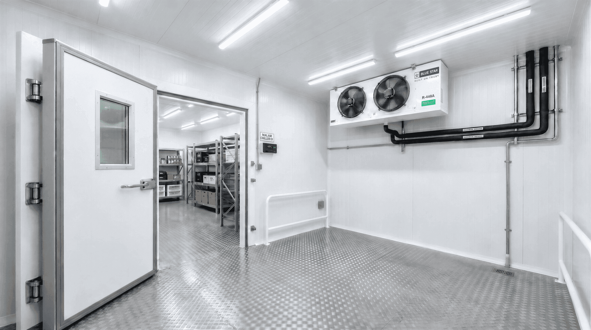 Commercial walk-in cold storage room constructed with modular PUF panels and evaporator cooling unit